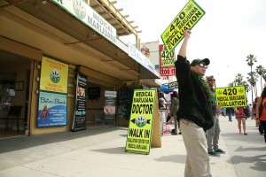 VENICE BEACH, CA - MARCH 13: People hawk "Medical Marijuana" on