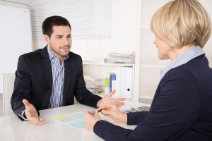 Job Interview Or Meeting Situation: Business Man And Woman At De